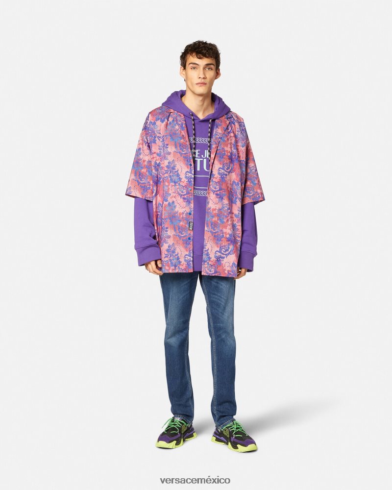 Versace vaqueros con emblema en V azul ropa hombres 84626J2383