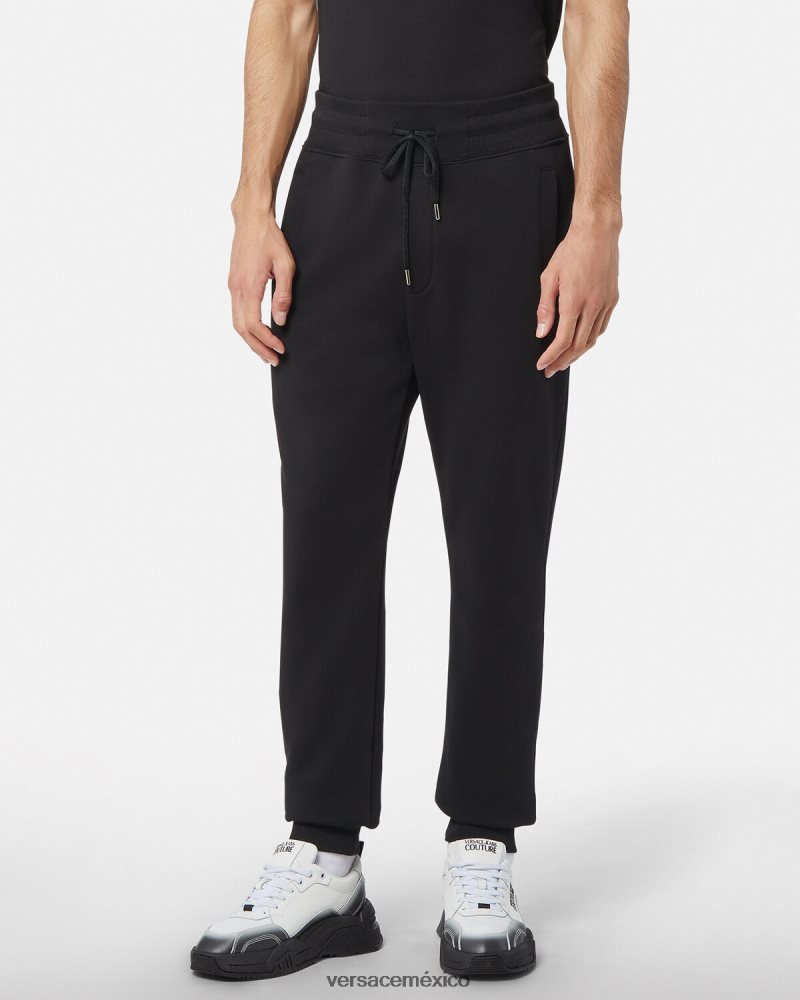 Versace pantalones deportivos con emblema en V oro negro ropa hombres 84626J2436