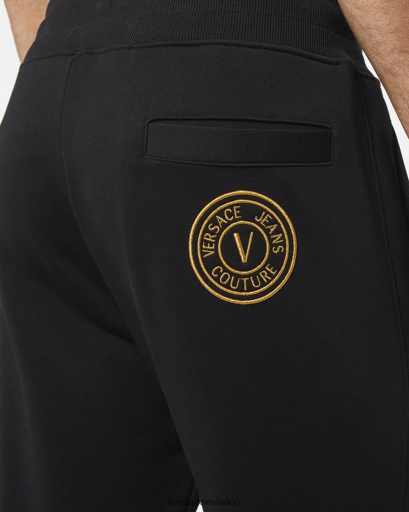 Versace pantalones deportivos con emblema en V oro negro ropa hombres 84626J2436