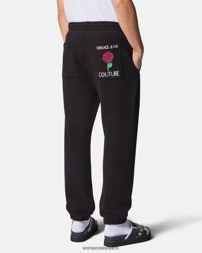 Versace pantalones deportivos con logo y rosas negro ropa hombres 84626J2381
