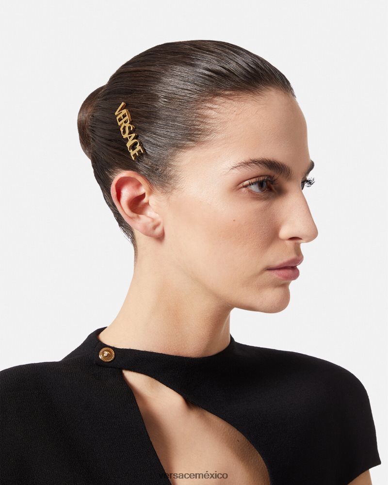 Versace clip de pelo derecho con logo oro accesorios mujer 84626J848