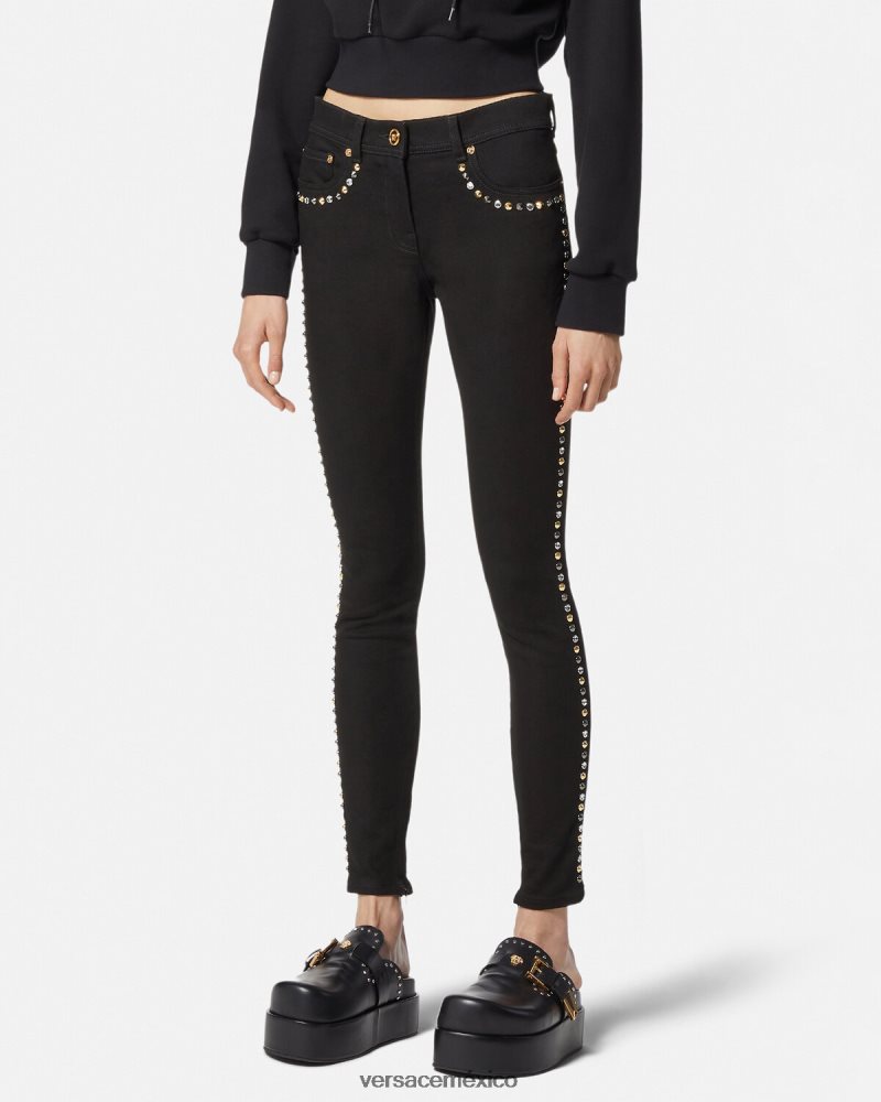 Versace jeans ajustados con tachuelas de Medusa negro ropa mujer 84626J214