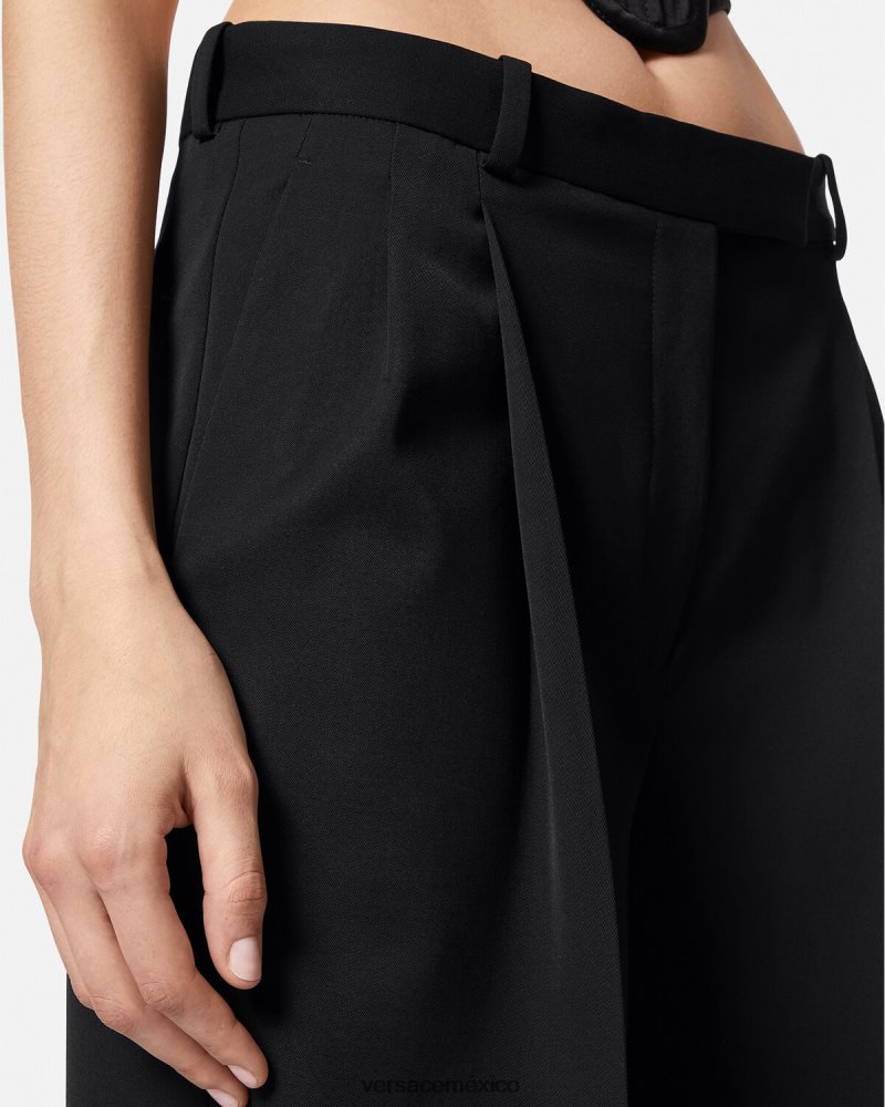 Versace pantalones anchos con pliegues negro ropa mujer 84626J200