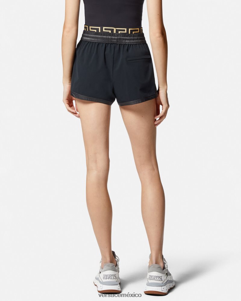 Versace pantalones cortos deportivos con borde de greca negro ropa mujer 84626J238