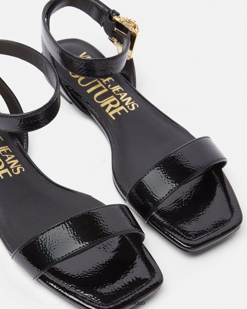 Versace sandalias planas Millie con hebilla barroca negro zapato mujer 84626J2259
